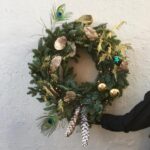 Kerstkrans met verlichting als relatiegeschenk